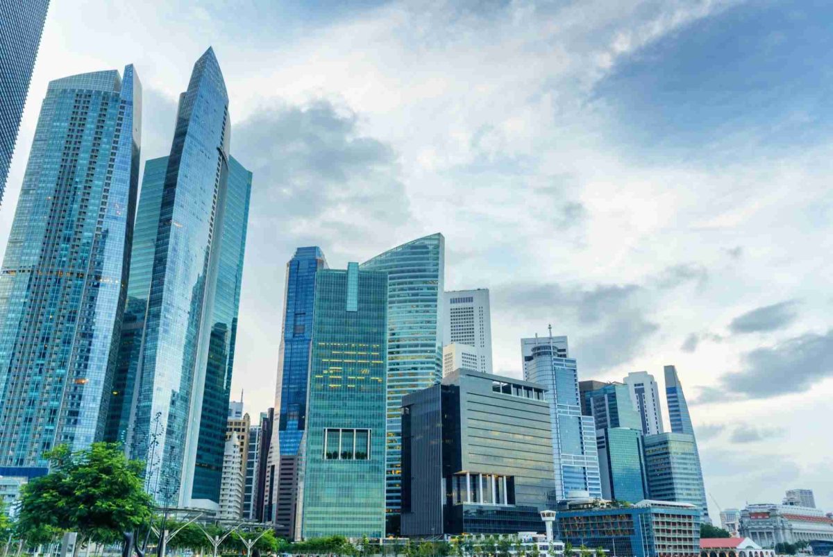 Modern financial district skyline in Asia representing insurance market growth